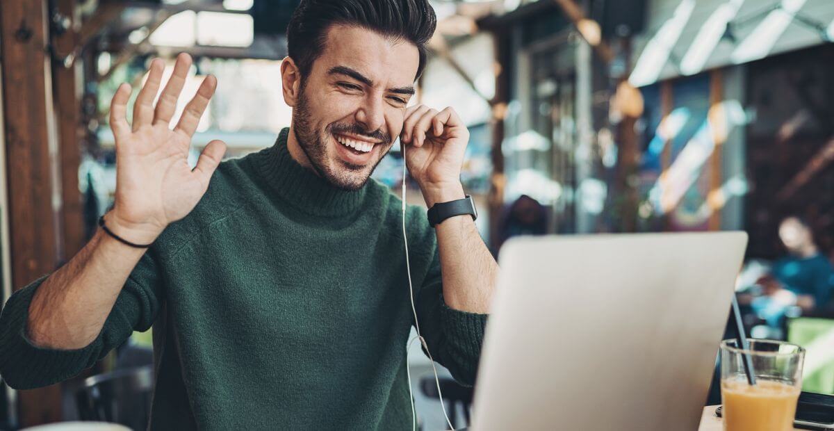 best video conferencing app - man on a video call smiling