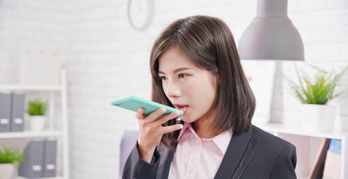 A woman speaking on her phone during an audio conference call