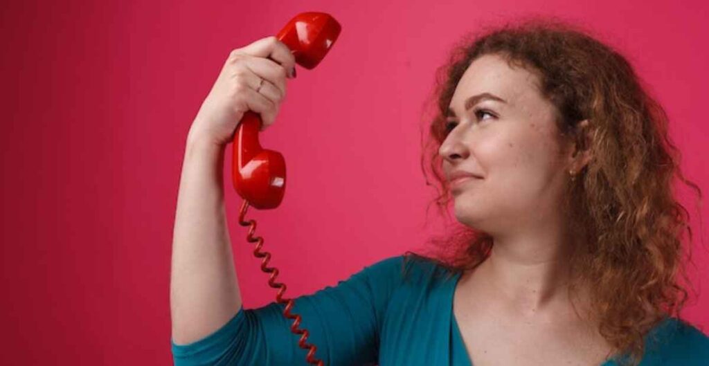 Woman considering factors to choose between free vs. paid conference calls