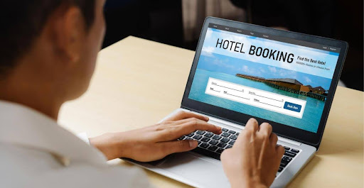 Stage 1: The entry points for customer engagements | A man booking a hotel on his laptop
